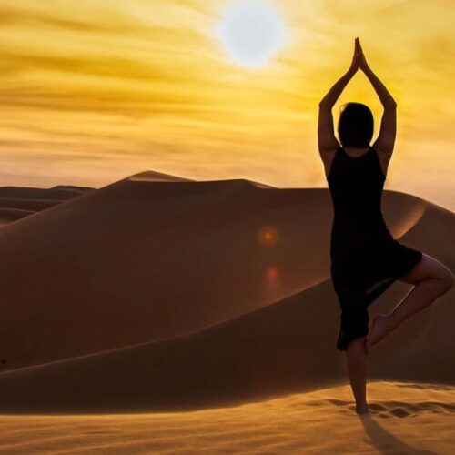 Yoga practice at a desert camp in the Moroccan Sahara