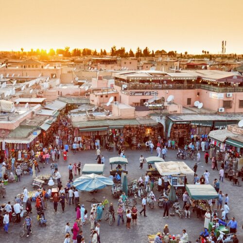 Travellers walking through a street in the Marrakech medina