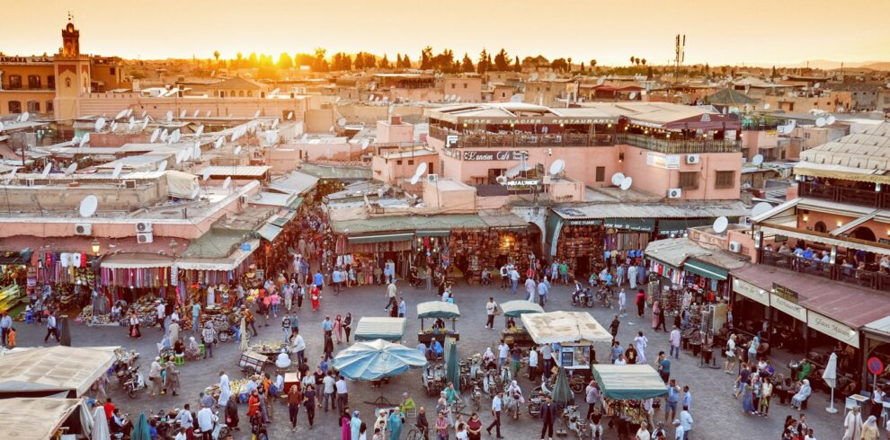 Travellers walking through a street in the Marrakech medina