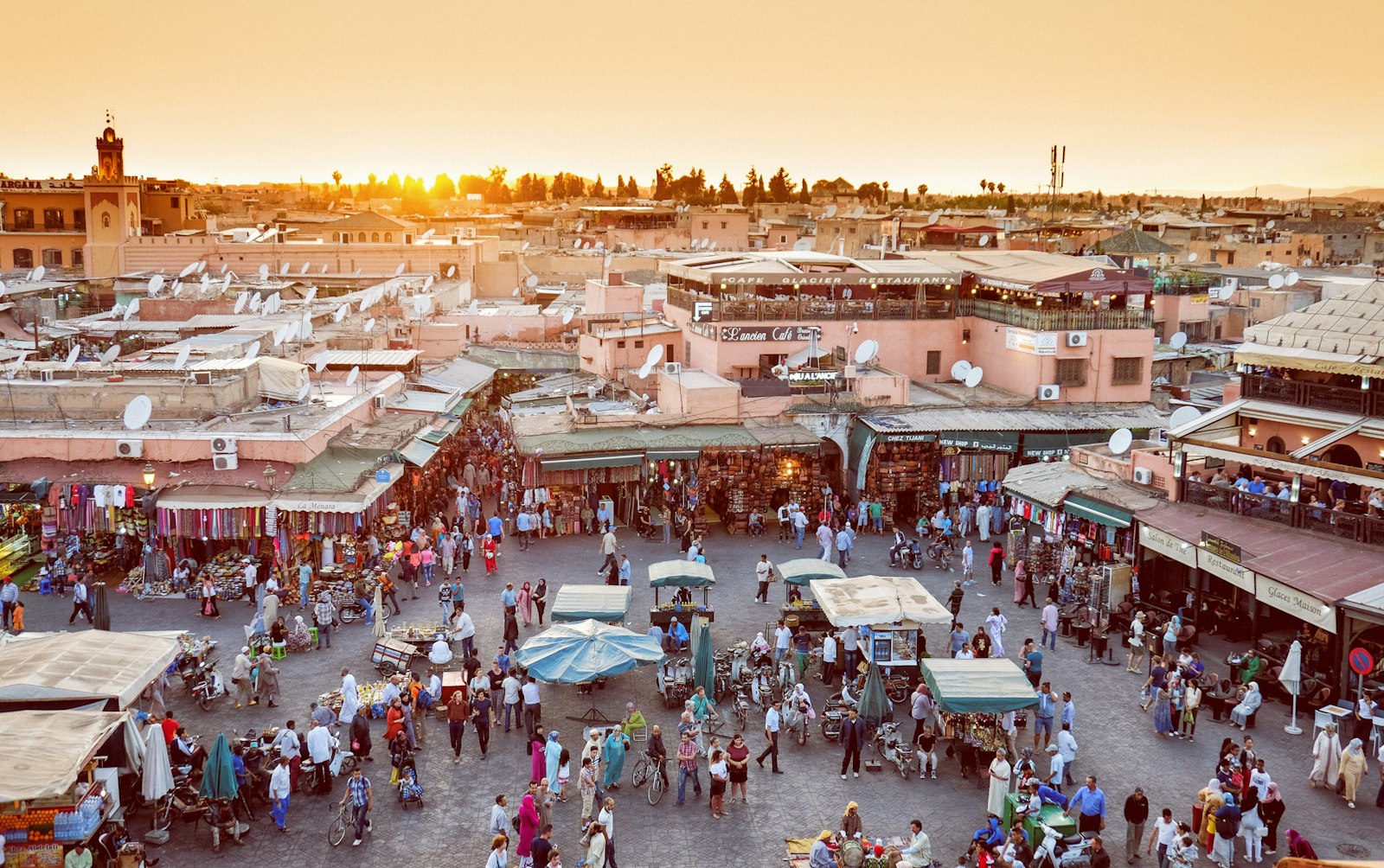 Travellers walking through a street in the Marrakech medina
