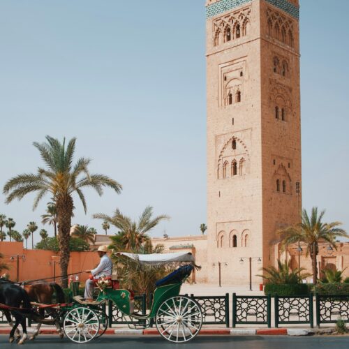 Horse-drawn carriage in front of the Koutoubia Mosque tower, Marrakech