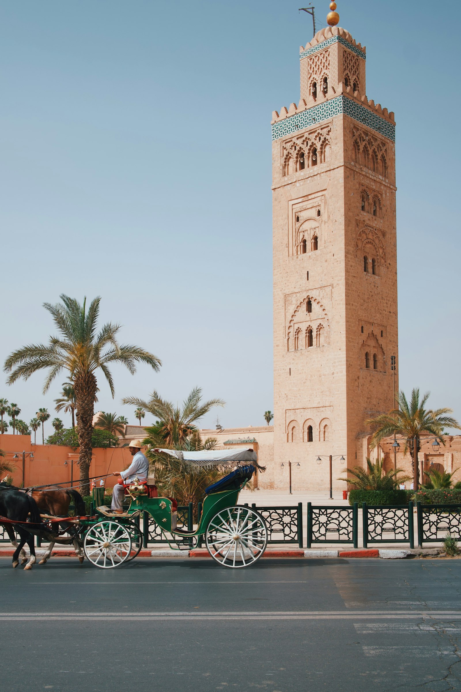 Horse-drawn carriage in front of the Koutoubia Mosque tower, Marrakech